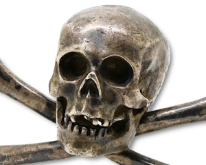 Finely modelled silver skull and crossed bones. Italian, 17th century.