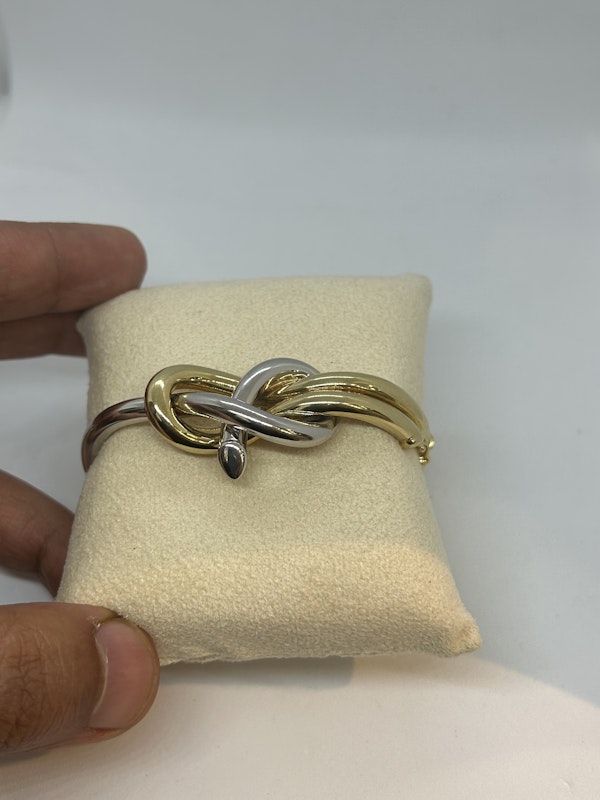 Stylish 18ct yellow and white gold knot bangle at Deco&Vintage Ltd - image 3