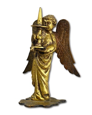 Medieval gilt bronze sculpture of a torchere bearing angel. French, circa. 1300.