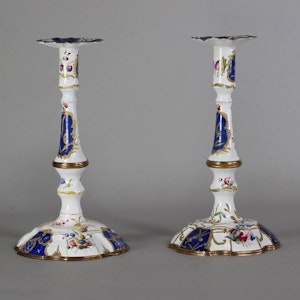 A pair of 18th century South Staffordshire, probably Bilston, enamel table candlesticks