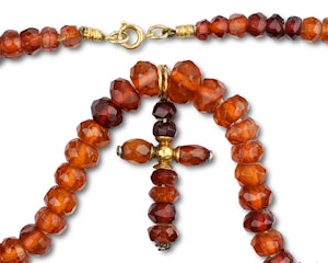 Gold and faceted amber necklace. European, 19th century.