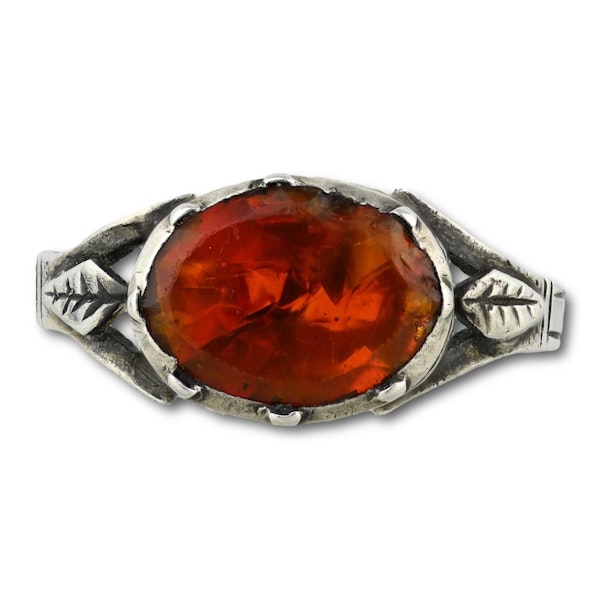 Silver ring set with a vibrant orange paste. French, late 18th century. - image 1
