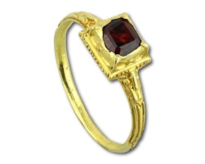 Renaissance gold ring with a table cut garnet. Western Europe, late 16th century
