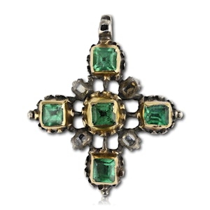 A gold and silver cross set with table cut emeralds and diamonds.  Spanish, early 18th century.