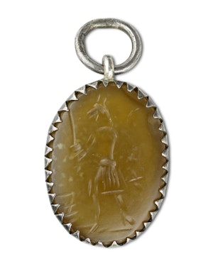 Silver pendant with gnostic intaglio of Anubis. Roman, 2nd-3rd Century AD.