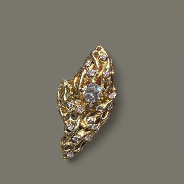 A Gold ring consisting of textured gold rods in an open lattice, scattered with 16 diamonds set in platinum. - image 2