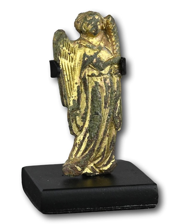 A gilt bronze figure of candle bearing angel. Probably French, 14th century. - image 6
