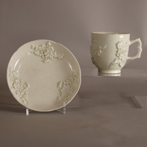 Bow blanc de chine cup with crabstock handle and saucer, circa 1752