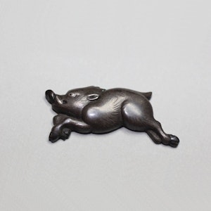 Japanese bronze menuki, in the form of a running boar