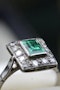 A very fine Platinum (tested) Cluster Ring set with a Modified Step Cut Emerald surrounded by gallery of fourteen Single Cut Diamonds. Circa 1930 - image 4