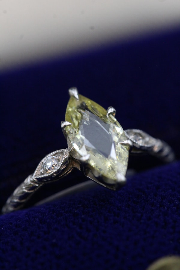 An excellent Platinum (tested) Marquise Shaped Natural and Untreated Fancy Yellow Diamond Solitaire Ring. Circa 1930. - image 1