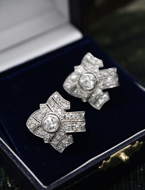 Downstairs at Grays: An Fine pair of Antique Platinum & 18 Ct White Gold Diamond Earrings, set with two Round Brilliant Cut Diamonds and Forty Six Round Brilliant Cut Diamonds on the sides.