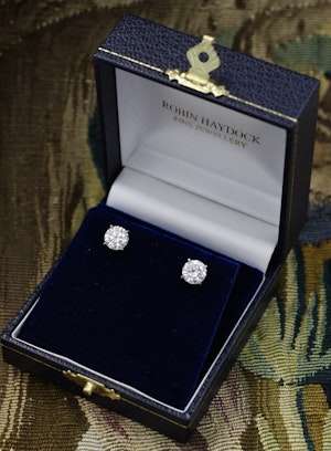 Downstairs at Grays: A fine pair of 18 Carat White Gold (Stamped) Diamond Earrings, two Round Brilliant Cut Diamonds of 3.03 Carats, G Colour & SI2 Clarity Pre-owned