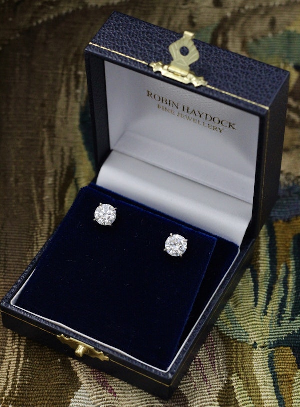 A fine pair of 18 Carat White Gold (Stamped) Diamond Earrings, two Round Brilliant Cut Diamonds of 3.03 Carats, G Colour & SI2 Clarity Pre-owned - image 1