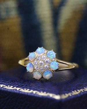 Downstairs at Grays: A very fine Opal and Diamond Cluster Ring in 18ct, (marked), Yellow Gold. Early 20th Century.