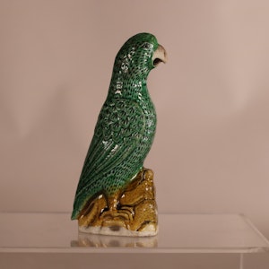 A Chinese famille verte biscuit parrot, Kangxi (1662-1722),
