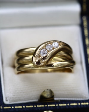 A very fine 18ct Yellow Gold Triple Snake Ring, set with three Old Round Cut Diamonds. Chester Hallmark 1906.