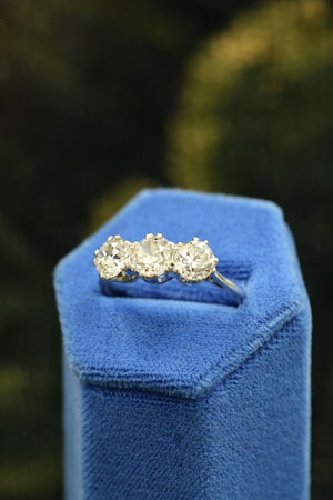 Downstairs at Grays: A very fine 18 carat White Gold (stamped), Three Stone Engagement Ring set with 2.25 Carats of Old Cut E - F Colour, VS Clarity Diamonds. Pre-owned.