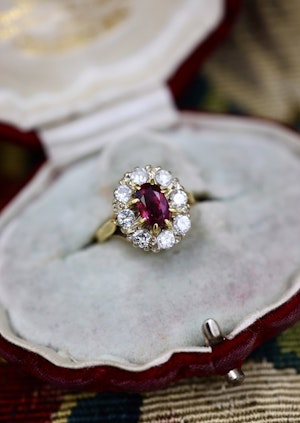 Downstairs at Grays: A very fine 18ct Yellow & White Gold Oval 1.35 Carat Siam Ruby & Diamond Cluster Ring. Circa 1975