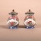 A pair of early Chinese Qianlong Canton enamel pomode pots and covers - image 2