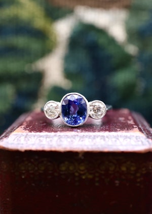 Downstairs at Grays: A very fine 18 ct.  White Gold & Platinum Oval 2.40ct Sapphire & Diamond Three Stone Ring. Circa 1935