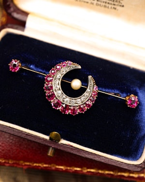 Downstairs at Grays: A very fine Victorian, Rose Gold & Silver, "Siam" Ruby, Natural Pearl and Diamond Crescent Brooch, with satellite Rubies. English Circa 1880