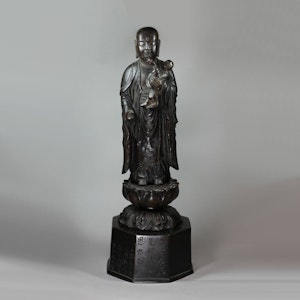 Rare Japanese bronze group of Buddha holding a child with a peach in its hand, late 18th century