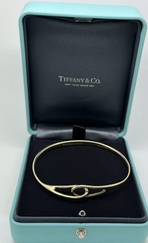 Tiffany & Co 18ct Yellow Gold bangle. Mark Constable Unit 301