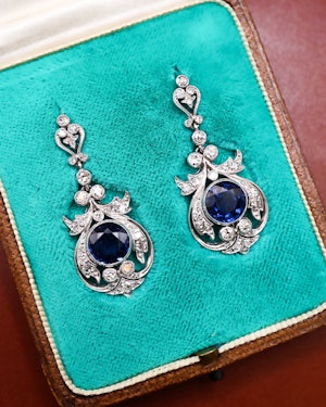 Downstairs at Grays, an exceptionally fine pair of Antique Natural Sapphire and Diamond Drop Platinum Earrings, English, Circa 1910.