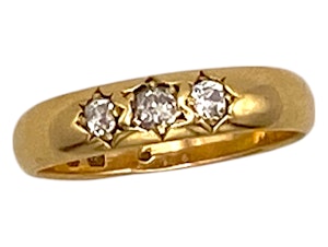 Heavy 18 ct. 3 stone diamond ring on wide band