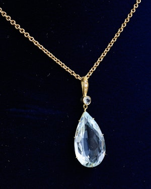 Downstairs At Grays: A fine 18ct. (tested), Yellow Gold Pear Shaped Aquamarine Pendant, with Seed Pearl Bail. Circa 1905.