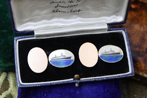 Downstairs at Grays: An extremely fine pair of oval 9ct Yellow Gold & Enamel Cufflinks celebrating the Queen Elizabeth II (Cunard), English, Circa 1969