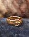 Downstairs at Grays: A very fine 18 carat Yellow Gold Buckle Ring, with a finely hand-engraved floral relief to the upper section. English. Hallmarks C.1897 - image 1
