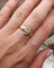 Downstairs at Grays: A very fine 18 carat Yellow Gold Buckle Ring, with a finely hand-engraved floral relief to the upper section. English. Hallmarks C.1897 - image 3
