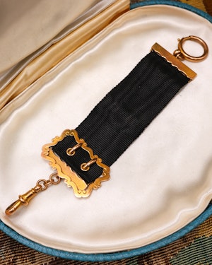 Downstairs at Grays: A very fine 9ct Yellow Gold Gentleman's Waistcoat Fob, a buckle design with black silk ribbon, stamped JG&S, Hallmarked Birmingham, 1909
