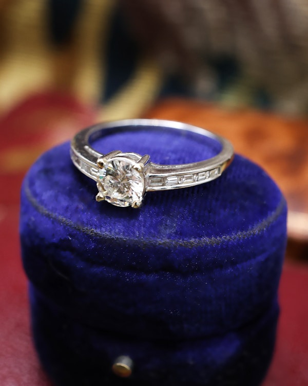 Downstairs at Grays: A very fine 18 ct White Gold Diamond  Solitaire Ring, 0.66 Carats Approximately, with shoulder settings of 0.18 Carats (stamped) of Modified Step Cut Diamonds.  Preowned - image 2