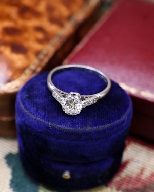 Downstairs at Grays: A very Fine 0.50 Carat, E Colour, VS1 Clarity Diamond Solitaire Ring, set in Platinum (stamped), with Diamond Set Shoulders. Circa  1950-1960
