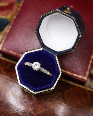 A fine 18ct Yellow Gold & Platinum Diamond Solitaire Ring with three Single Cut Diamonds to each shoulder. Circa 1950