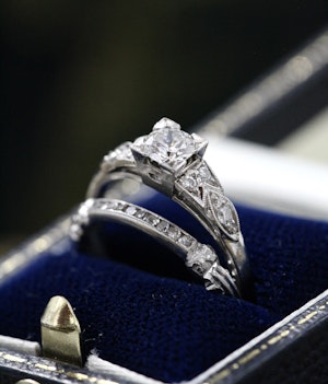 A finely worked Platinum, Iridium & Diamond Engagement Ring with matching "Quarter" Eternity Ring Circa 1935