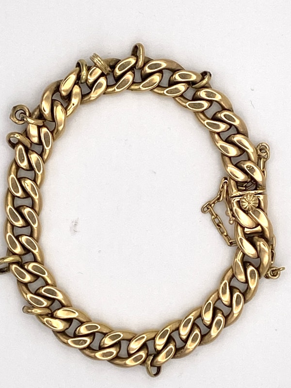 Heavy 18 ct. gold flat curb bracelet with rings fitted for charms suspension. 63 grams weight - image 1