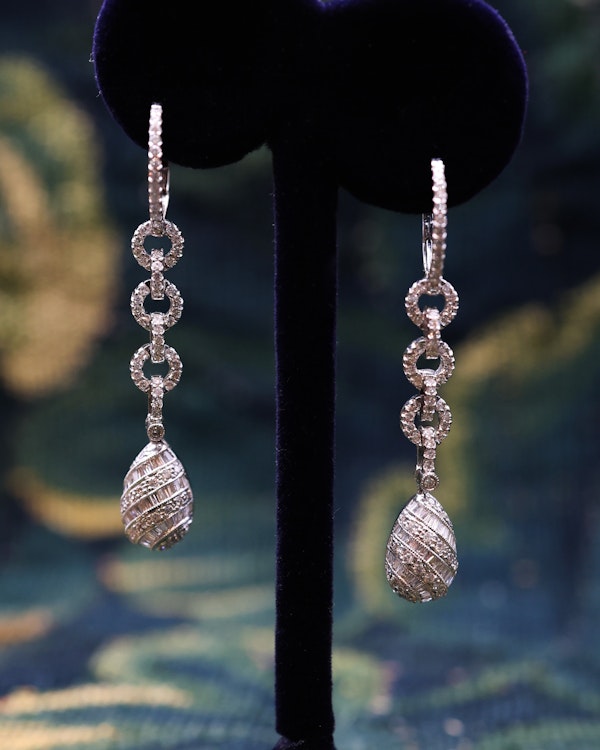 A fine pair of 18ct White Gold (marked), Round Brilliant & Emerald Cut Diamond Drop Earrings. approximately 1.35 Carats (unweighed). Pre-owned. - image 1
