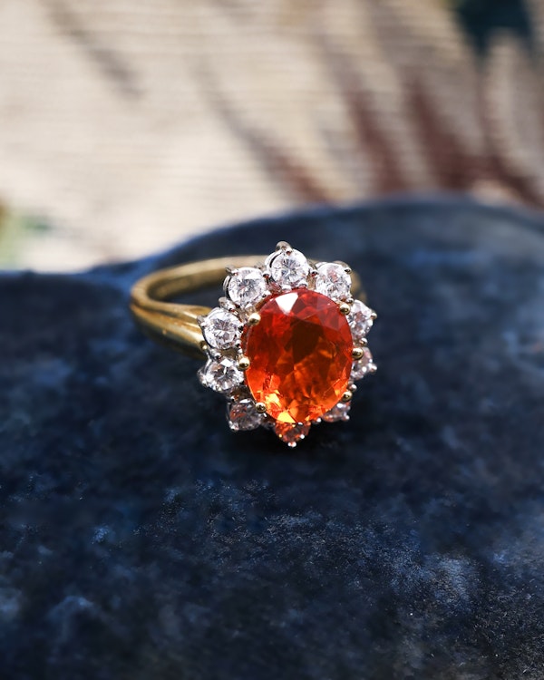 A very fine 18 Carat Yellow & White Gold Oval Fire Opal and Diamond Cluster Ring. London Hallmarks. Circa 1993. - image 2