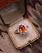 A very fine 18 Carat Yellow & White Gold Oval Fire Opal and Diamond Cluster Ring. London Hallmarks. Circa 1993. - image 4