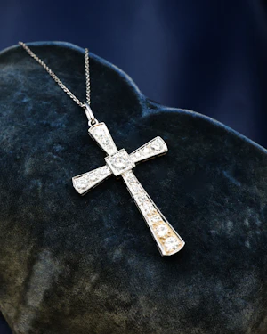 Downstairs at Grays: A very fine 18ct White Gold (Tested), 1,20 Carat (approximately), Diamond Cross, with an articulated bail and later 18ct White Gold Chain.