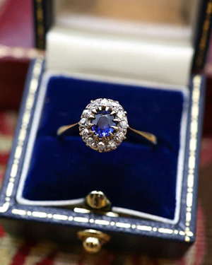 Downstairs at Grays: Yellow Gold (High Carat tested), Small Oval Sapphire & Diamond Cluster Ring, Circa 1920