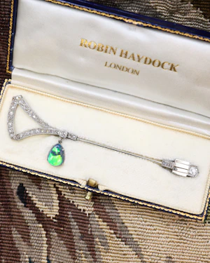 Downstairs at Grays: A very fine Platinum & 18ct Gold  (French marks) Diamond & Pear Shaped Black Opal Jabot Pin Circa 1920