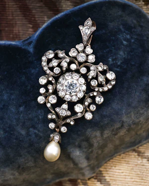 Downstairs at Grays: A High Carat Yellow Gold, Silver Tipped Foliate Pendant, set with Victorian paste stones and one Drop Cultured Pearl. Circa 1890.