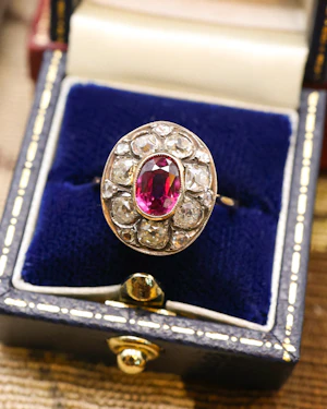 Downstairs at Grays: Natural "Siamese" Oval Ruby and Diamond Cluster Ring Circa 1910