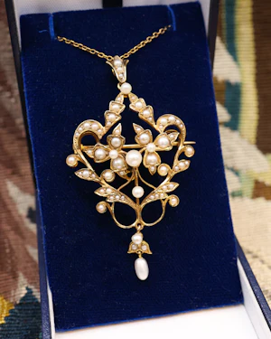 Downstairs at Grays: A Beautiful 15 Carat (stamped) Yellow Gold Natural Seed Pearl Pendant Brooch, English, Circa 1900.