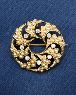 Downstairs at Grays: A 15ct. (stamped) Yellow Gold & Platinum Seed Pearl & Diamond Brooch with a Pendant fitting. Circa 1880
